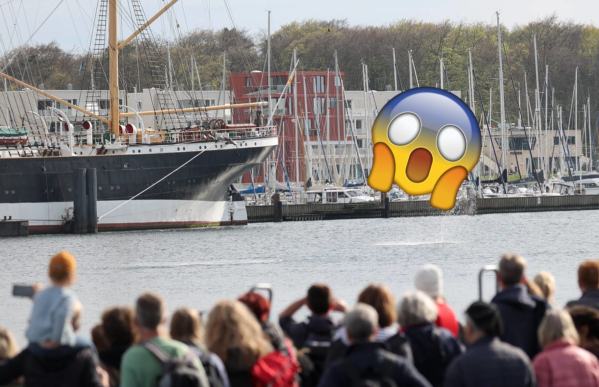 Ostsee, Travemünde, Schaulustige beobachten Wasser und Boote