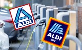 Autos an Ladesäule mit Aldi Logos.